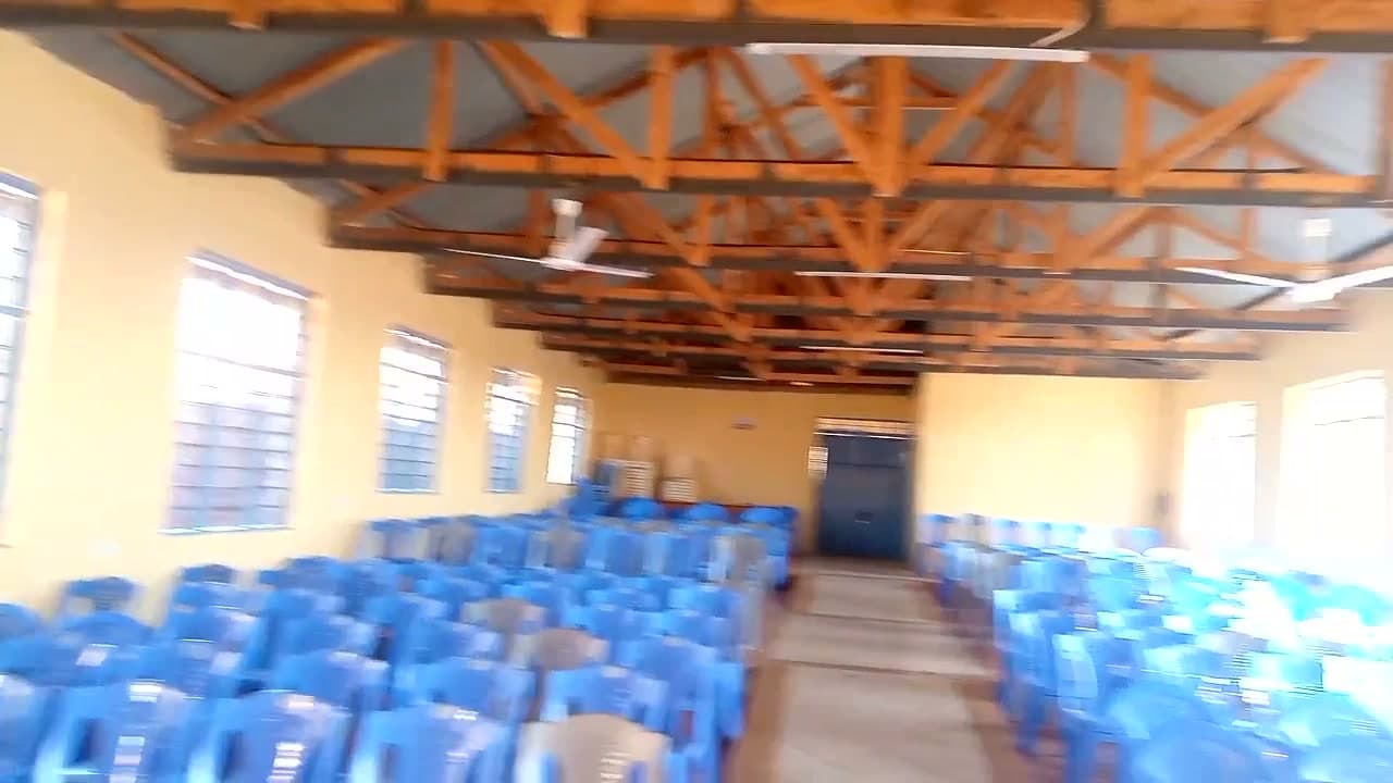 Ceiling fans hung from the timber roof trusses