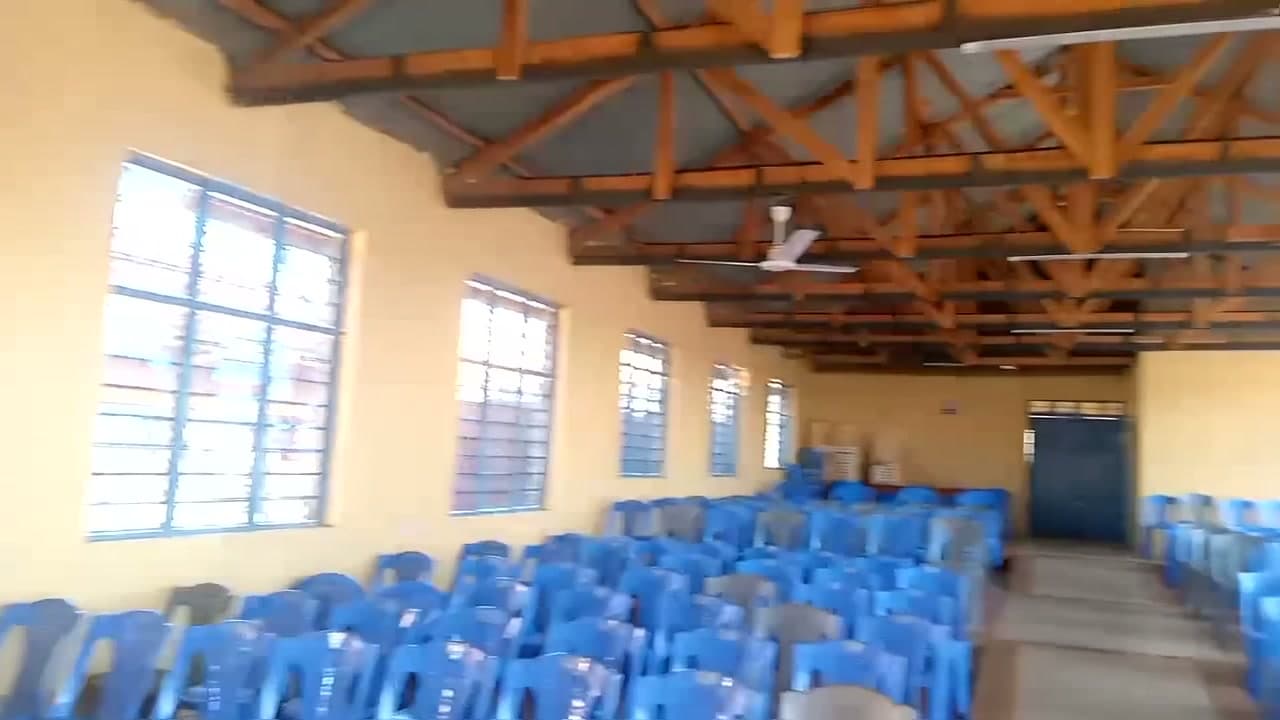 Inside Murata Social Hall under its exposed timber roof